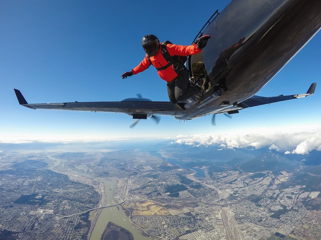 skydiver jumping out of plane